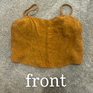 a brown corset that clips up in the front